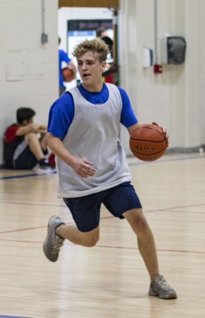 A NW student looks to sidestep an opponent during intramural basketball Sept. 21 in the NW gym.