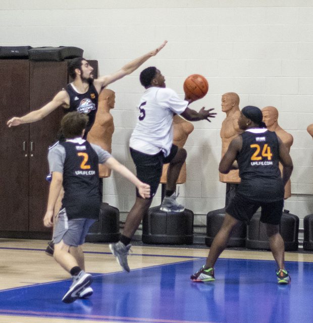 NW students try to defend as an opponent goes in for a layup during the intramural basketball tournament Sept. 21 in the WHPE building. Tennis is the next NW intramural event 4-7 p.m. Oct. 11 on the NW tennis courts.