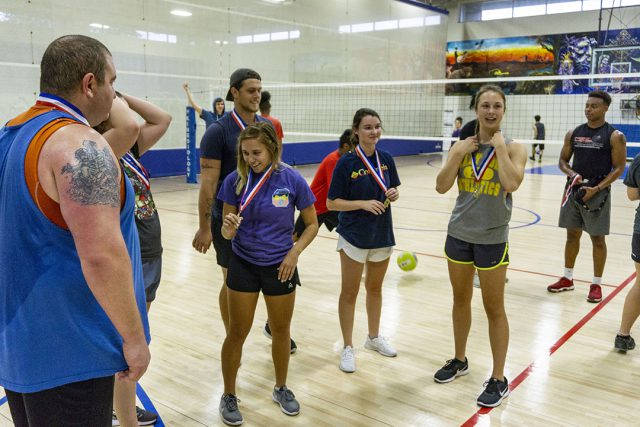 CV Squad team members receive medals for defeating the rest of the competition in intramural volleyball. The team went undefeated through the bracket.