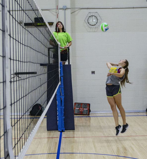 NW student Lauren Rose looks to crush the ball with a spike. Rose was one of the six members of the winning team during the intramural volleyball tournament.