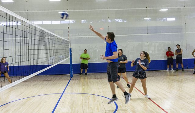 The ball is sent back over the net by a NW student while his teammates stay ready during intramural volleyball. Intramurals are free for TCC students, faculty and staff.