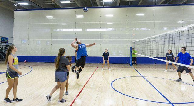 NW+student+Hans+Reeves+lines+up+to+spike+the+volleyball+during+NW%E2%80%99s+intramural+volleyball+tournament+Sept.+6.+Most+campuses+offer+different+intramural+sports+during+the+semester.