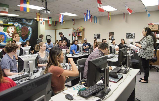 NW instructional associate Melanie Mendez introduces a speaker during one of the campus’ Latino Culture Series events during Hispanic Heritage Month in 2017. 