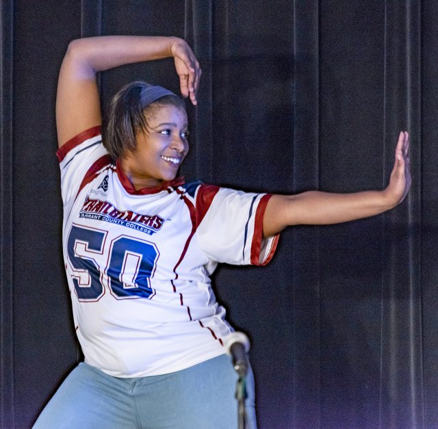 NE student Taylor Hayes performs a dance move with the Movers Unlimited dance company during the Harmony celebration event Oct. 16 in Center Corner. The event included music, poetry reading, games and food.