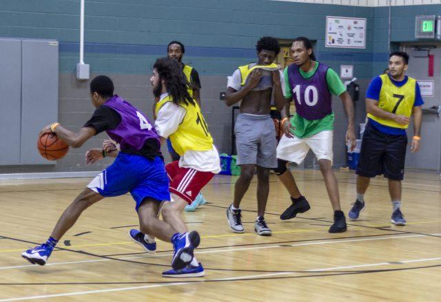 SE student and Dope Boys team member Adrian Morales guards a member of TCC Underdogs in the 5-on-5 intramural basketball championship Oct. 19 on SE Campus. The Dope Boys won the game and earned their second championship title.