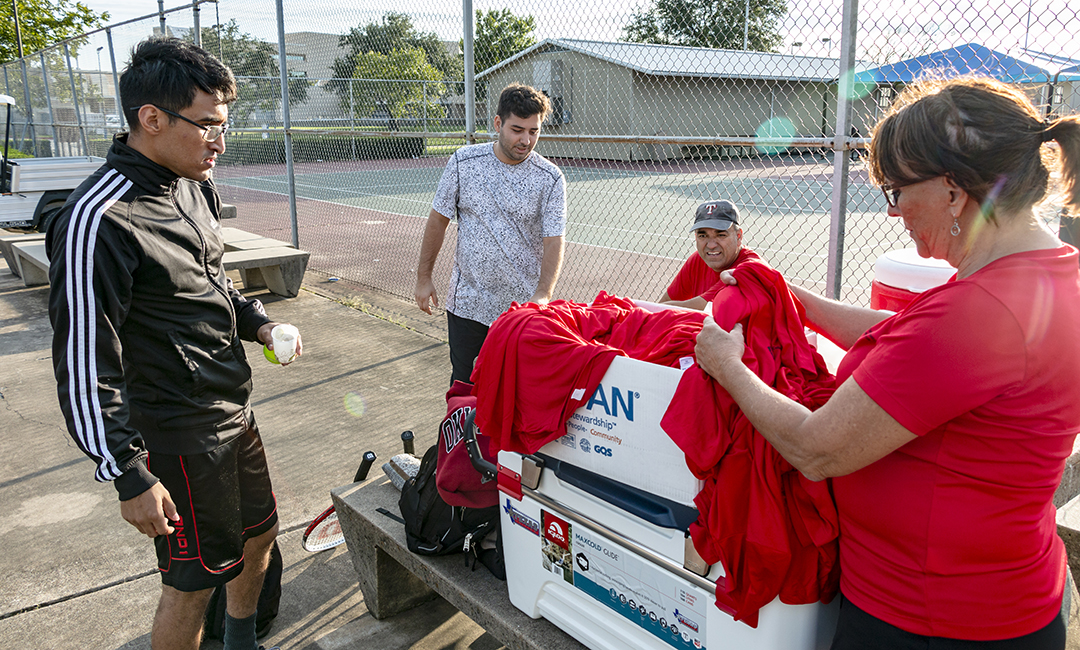 Karin Davidson from the NW Tennis Club hands out shirts to everyone who participated in the intramural tennis tournament Oct. 11 on NW Campus. Intramurals cycle through different sports throughout the semester, and students can contact their campus kinesiology department for upcoming events.