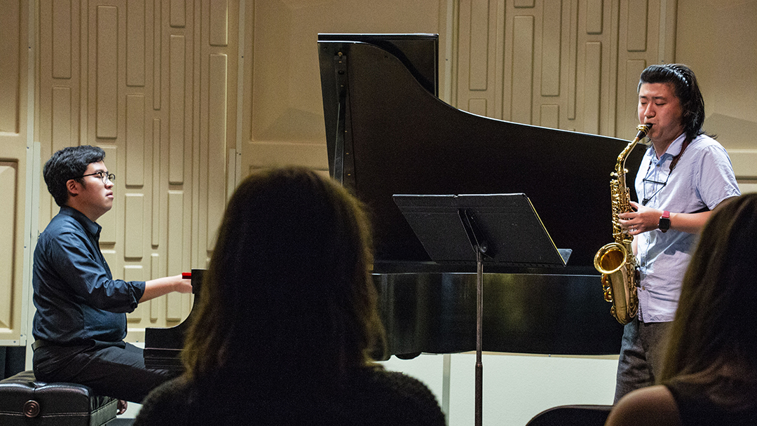 NW music adjunct instructor Tak Yan Yeung plays piano while guest artist Bowen Feng plays the saxophone during a duet for the NW Guest Artist Series: Saxophone Recital in the NW Recital Hall (WFAB 1105) on Sept. 24.