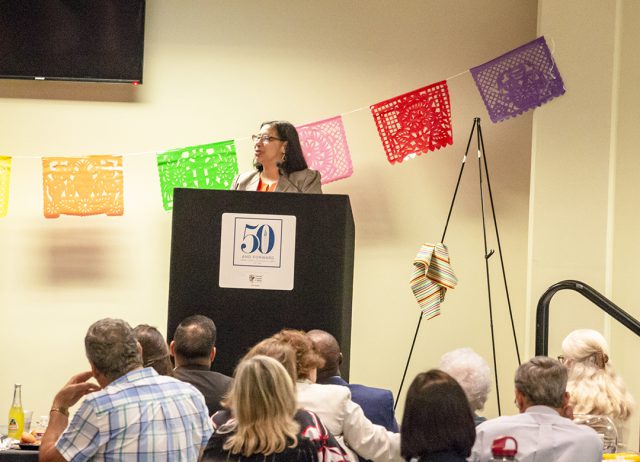 UT San Antonio professor Mariela A. Rodriguez speaks at the Abrazando al Exito scholarship banquet Oct. 9.