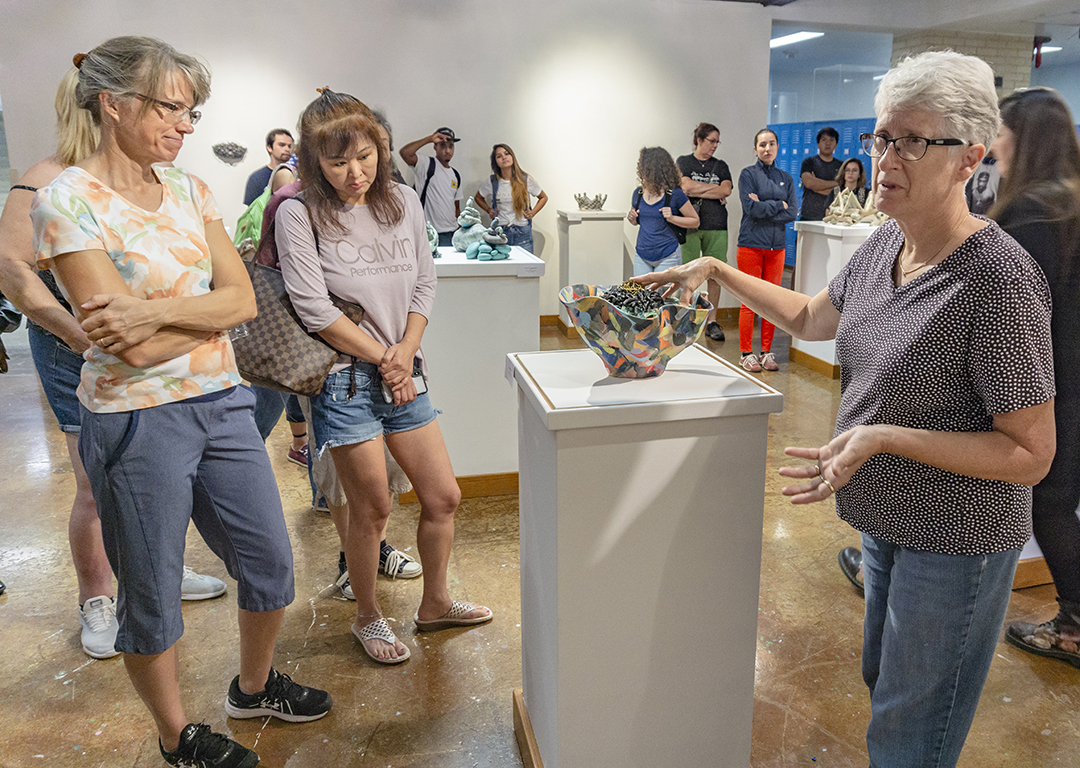 During an opening reception Oct. 8, artist Barbara Frey shares the array of ceramic techniques she used to create the different pieces that are on display in the Lakeview Gallery on NW Campus now through Nov. 1.