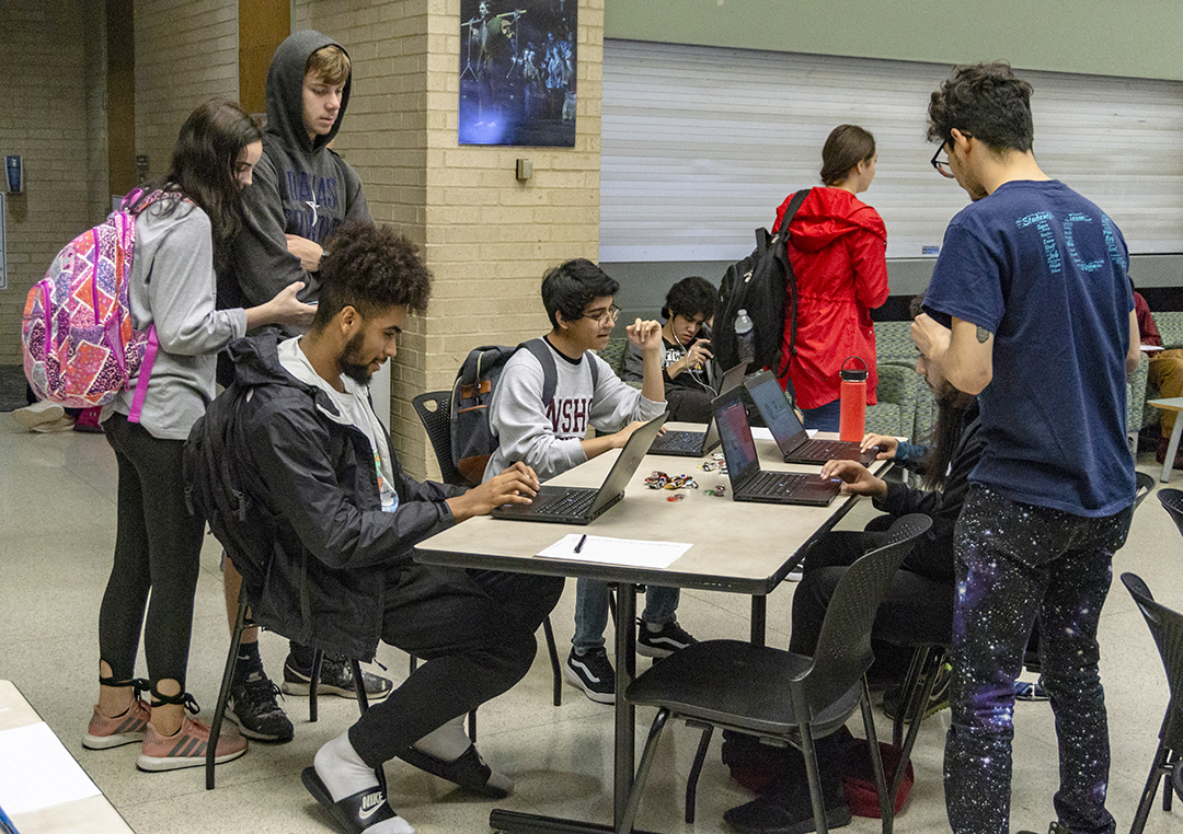 NW students play a game called LightBot on laptops that introduces them to basic programming logic at Candy and Coding Oct. 9 on NW Campus.