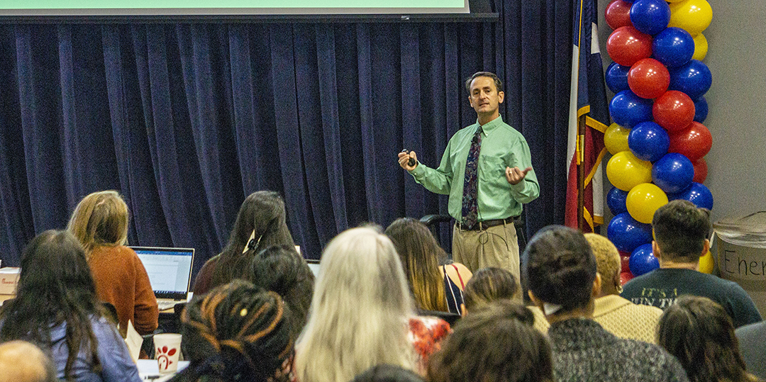Derek Schreihofer, UNT Health Science Center pharmacology and neuroscience associate professor, speaks to students about medical research Sept. 26 in the TR Energy Auditorium.