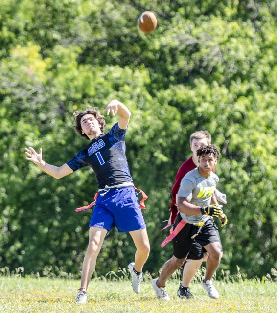 SE student Antonio Wauer throws a long pass as his teammates, SE students Jose Decruise and Nick Nunnally, look on during SE intramural flag football Oct. 4.