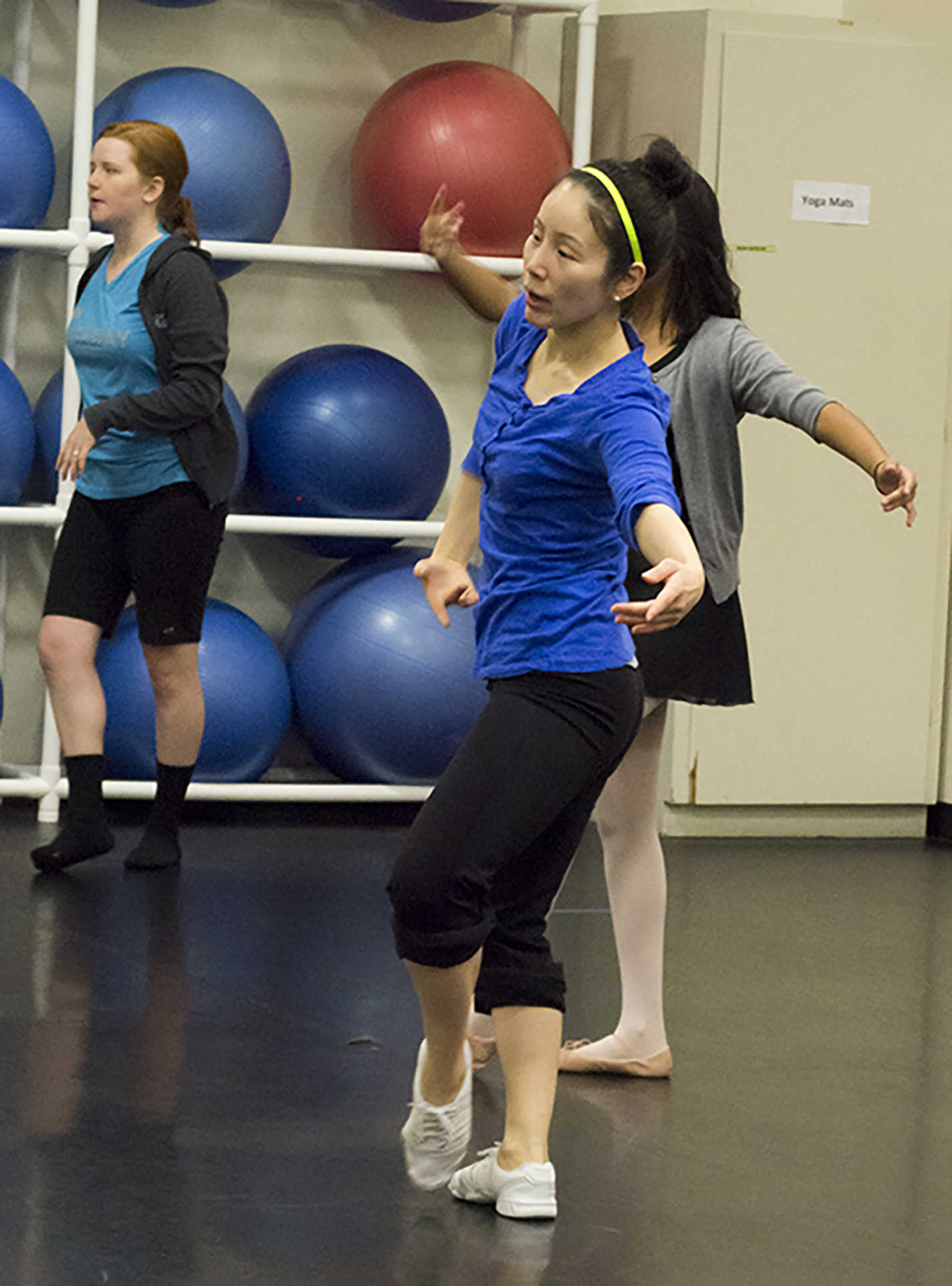 NE dance program coordinator Kihyoung Choi works with students during a class.