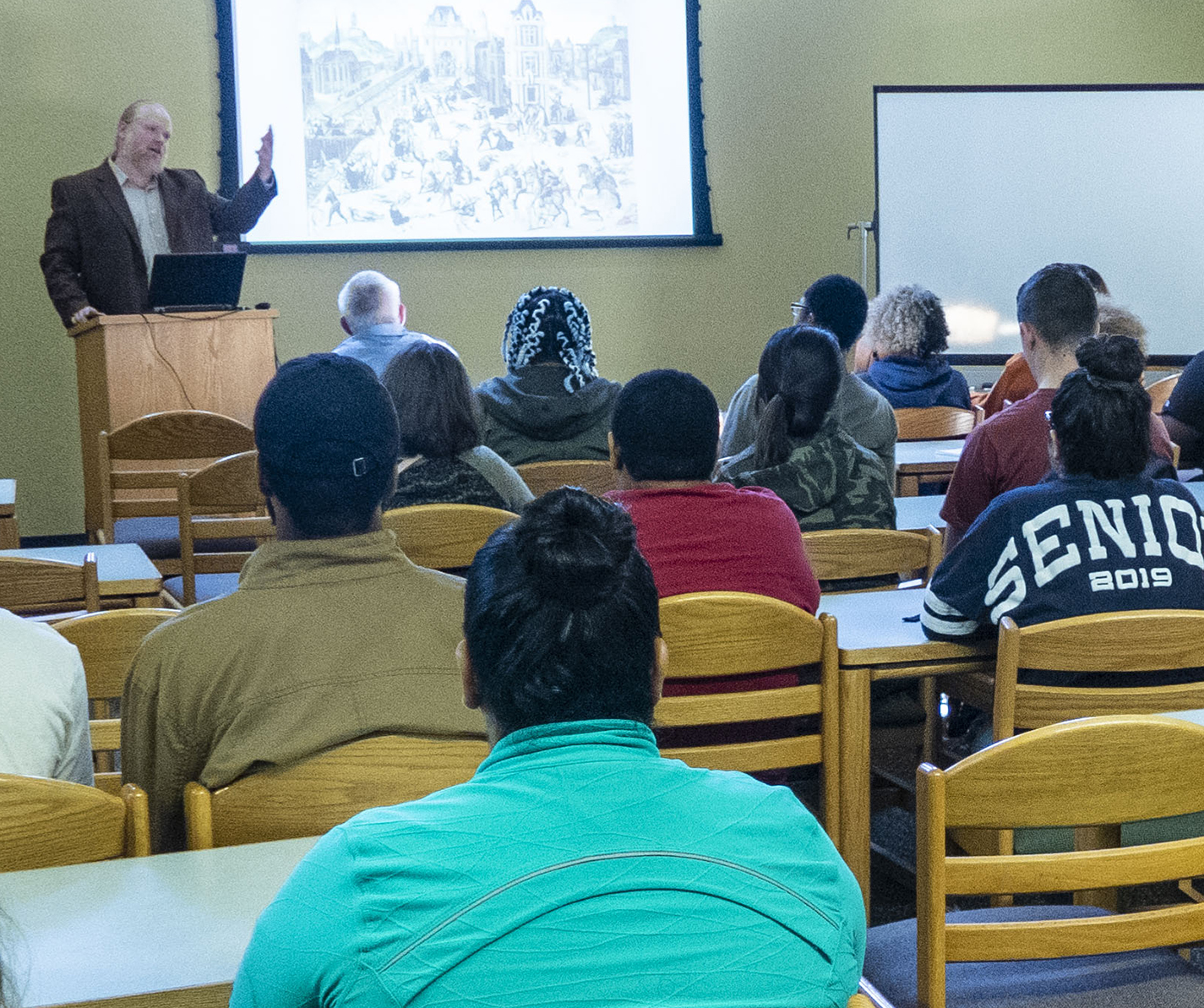 SE history assistant professor Mike Downs explains the history of the transition of Renaissance beliefs of magic to science Oct. 23 in the Library Classroom on SE Campus.