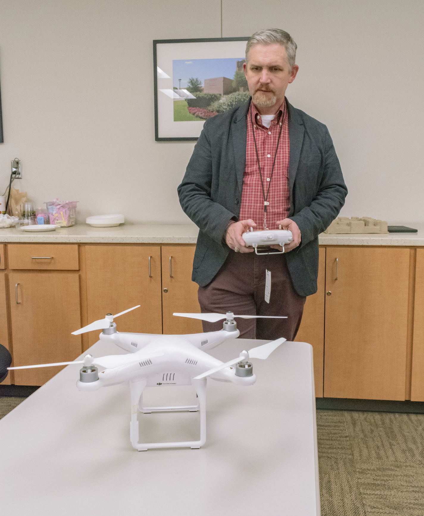 NE special projects coordinator Harry Johnson demonstrates how to operate the Phantom 2 drone which is a part of the remote pilot certification test prep course, where students can learn about regulations for drone flying on the NE and NW Campuses.