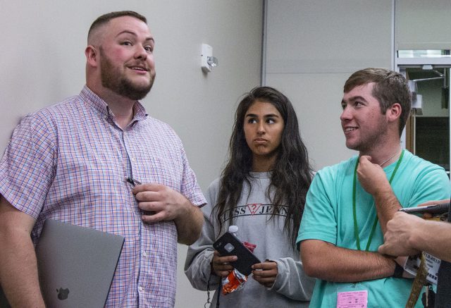 SE students converse while election results come in during the Nov. 6 election watch party in ESCT 1207 on SE Campus.