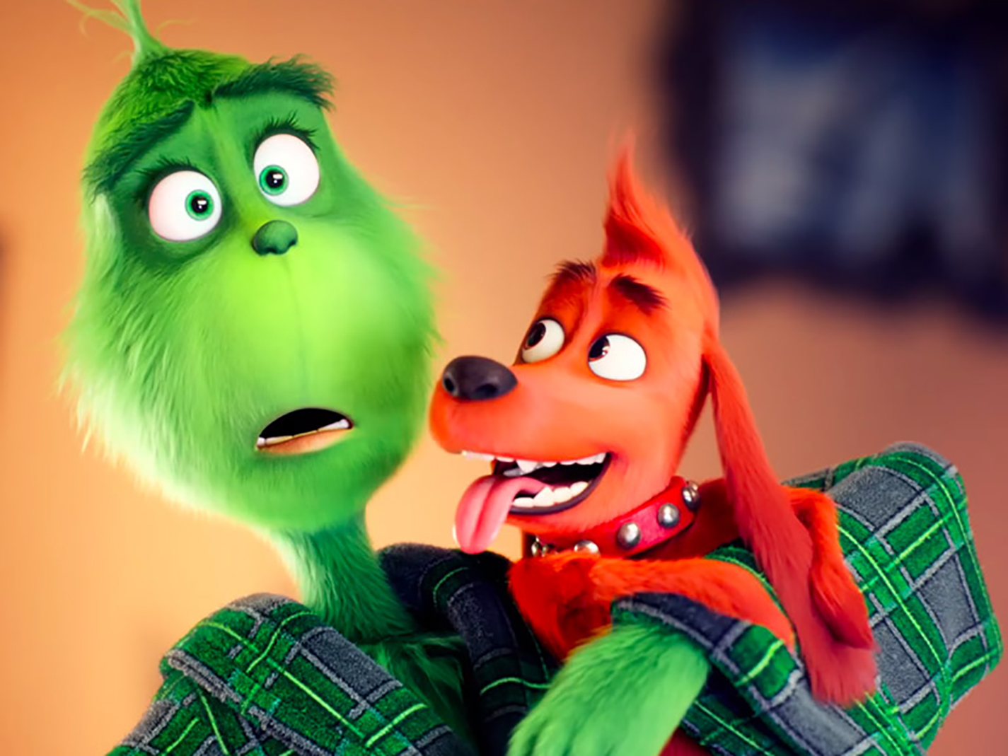 The Grinch’s titular character holds his dog Max in a state of bewilderment at the endless holiday cheer from Whoville’s residents. The movie was released in theaters Nov. 9.