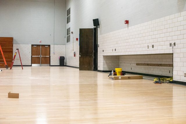 The gym floor is being resurfaced and treated for the water damage . The treatment process is performed in stages. Photo by Joseph Serrata/The Collegian
