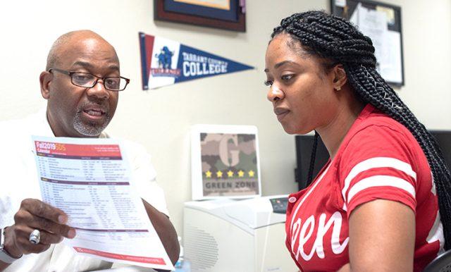 The first week of school can be stressful for some students. SE student Essence Steadman-Johnson talks to veteran’s counselor Dartanian Chandler about her benefits. Photo by Joseph Serrata/The Collegian