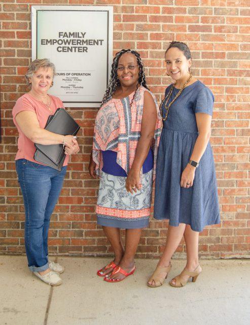 Photo by Kat Parker/The Collegian
Family Empowerment Center partners Amalia Guadalupe, Vera ruffin and Yolanda Sifuentes stand by the center on South Campus.