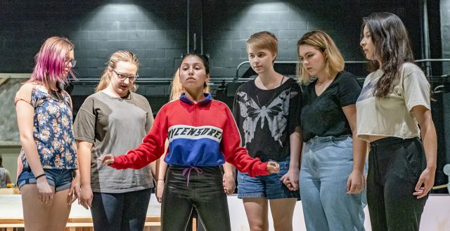 Student performers with the NE Campus theater program practice choreography and rehearse their lines on stage for “The Crucible.” The 1953 Arthur Miller play is based on the Salem witch trials. Photo by Joseph Serrata/The Collegian
