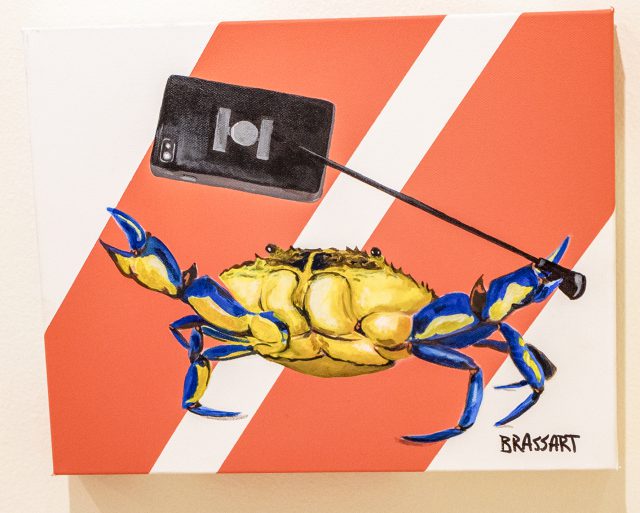 Also in the exhibition is Eddie Brassart’s abstract piece of art with the playful title, “Selfish Shellfish.” It is an acrylic on canvas depicting a crustacean selfie. Photo by Joseph Serrata/The Collegian