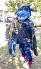 Photo by Christa Jarvis/The Collegian. NE student Alyse Whitcomb poses for a photo with TCC’s mascot Toro, who is dressed up in a Harry Potter-themed costume.