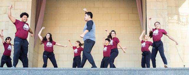 Photo by Johnathan Johnson/The Collegian. The NE Movers Unlimited dance company performs a hip-hop routine during the collaborative Converge Dance Concert on Sept. 26 in Sundance Square.