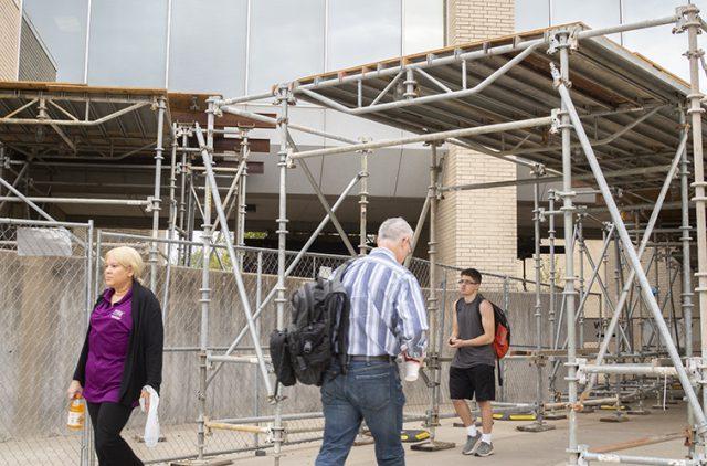 Photo by Johnathan Johnson/The Collegian. Scaffolding was installed January 2017, almost a year after the facade collapsed, to keep students and faculty safe as they walk on campus. It remains in place for the foreseeable future.
