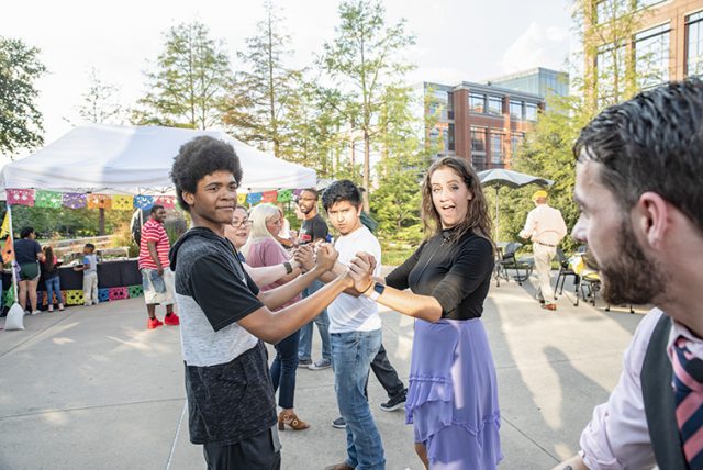 Photos By Joseph Serrata/The Collegian. Fort Worth Arthur Murray Dance Studio instructor Emily Miliani demonstrates the basics of salsa with TR students as a part of “Noche de Salsa” Oct. 3 on TR Campus.