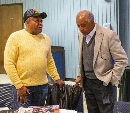 Continuing Education and Engagement student Johnny Lewis and former South Campus dean of community service Ambrose Adams socialize after the conclusion of Senior Bash.