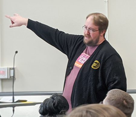 Photos by Joseph Serrata/The Collegian. NE library manager James Ponder explains to the audience how power is defined and challenges those in attendance to consider how they use privilege to help others at the Power and Privilege Town Hall.