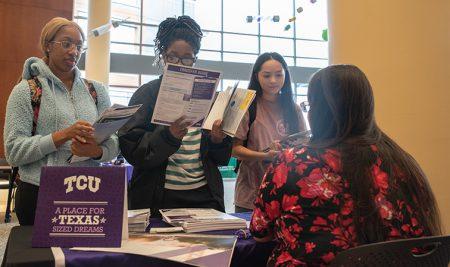 Prospective transfer students discuss their options with a representative from Texas Christian University.