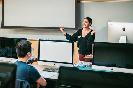 Associate art professor Janae Corrado touches upon the good and bad design aspects for the evaluation procedure of the magazine in her Design Communications I class Jan. 16.