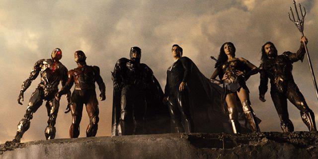 All six members of the Justice League stand united on a crumbling ledge. A version of this shot first appeared in the 2017 theatrical cut with different framing and color scheme. Photo Warner Brothers