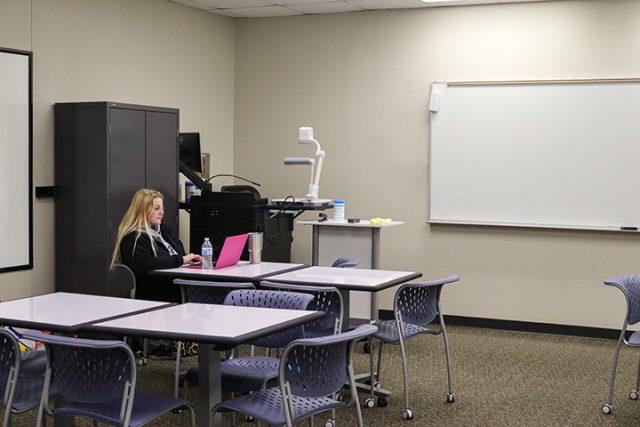 Alex Hoben/The Collegian
SE student Brooke Newsome sits in an empty classroom on SE Campus. 
