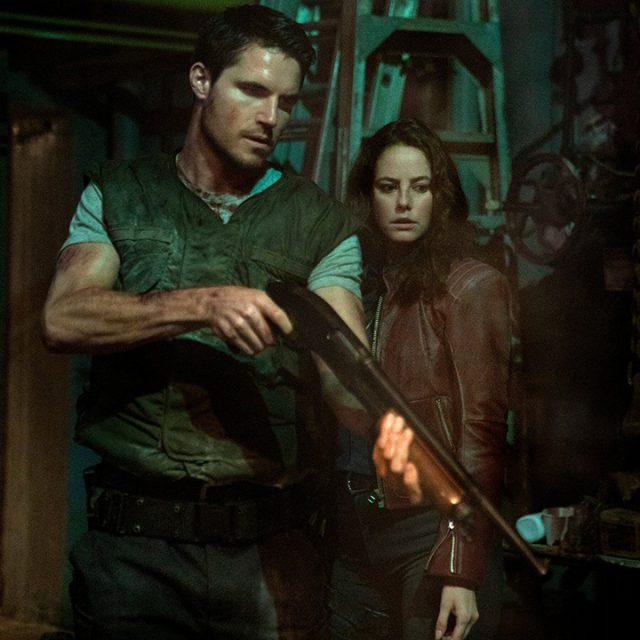 Photo+courtesy+of+Sony+Pictures%0ASiblings+Chris+and+Claire+Redfield%2C+played+by+Robbie+Amell+and+Kaya+Scodelario%2C+inspect+a+shotgun%2C+alluding+to+the+source+material.+The+film+is+exclusive+to+theaters.+