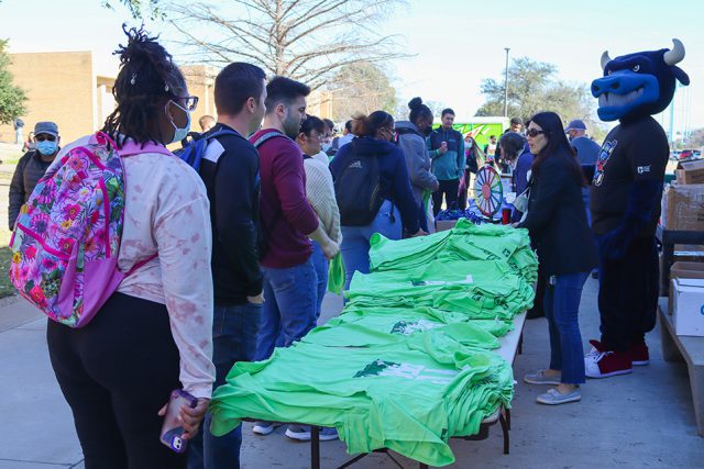 Toro, TCC’s mascot, hands out shirts and lanyards during NE Campus’ Toro Tuesday. Photo by Alex Hoben/The Collegian