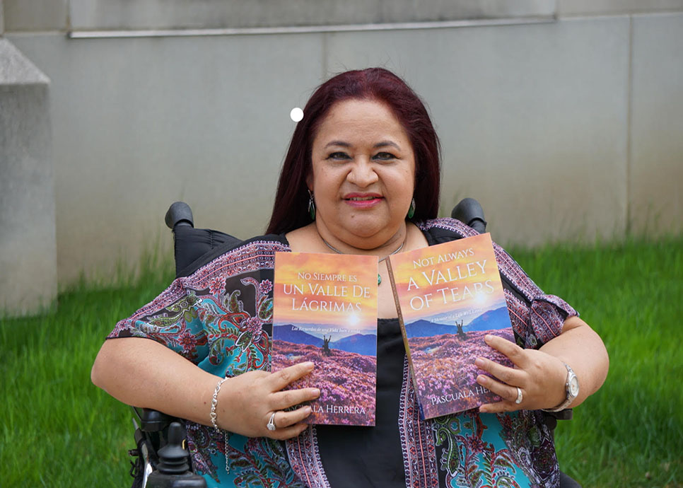 Pascuala Herrera poses with her book “Not Always a Valley of Tears.” Photo courtesy of Pascuala Herrera