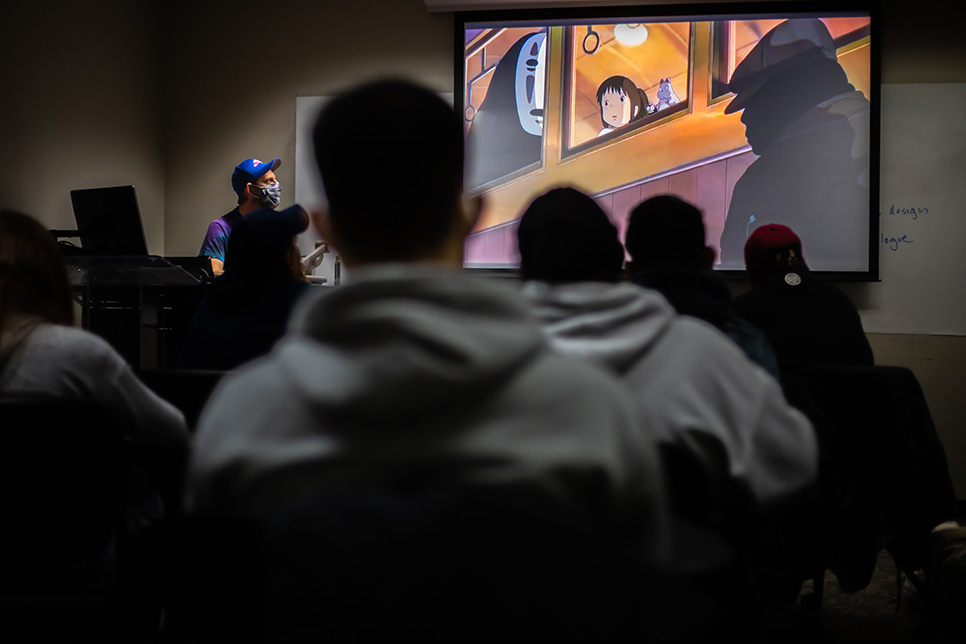 Students watch clips from the film “Spirited Away” in Adrian Cook’s Film Appreciation class Jan. 25. Joel Solis/The Collegian