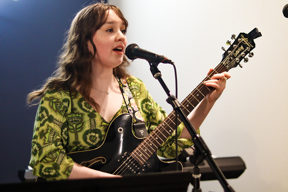 NW Music Association President Gillian Johannesen performs at the Avoca Coffee Roasters April 16. Photos by Alex Hoben/The Collegian