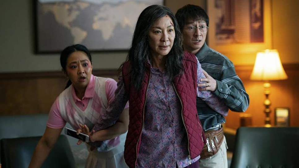 Joy, Evelyn and Waymond Wang take cover from an assailant. “Everything Everywhere All at Once” released only in theaters. Photos courtesy of A24