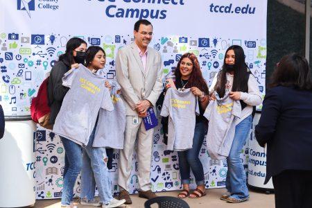Connect Campus President Carlos Morales poses for a photo with students during Spring Fest April 5.