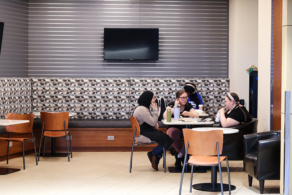 TR student Huda as well as workers Hailee and Audrey dine in the cafe found on TR campus. Alex Hoben/The Collegian