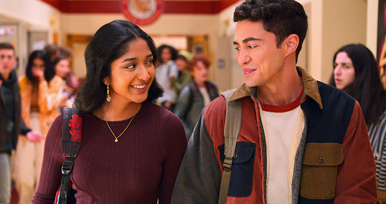 Devi Vishwakumar and Paxton Hall-Yoshida walk down the hallway in their relationship debut during season 3 of “Never Have I Ever.” Photo courtesy of Netflix