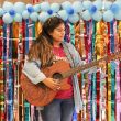 NW student and ALAS member Bertha Martinez plays her guitar “Luna” onstage during the Fiesta event. Photos by Ariel Desantiago/The Collegian