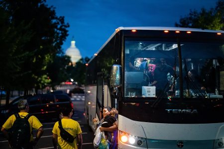 Texas Gov. Greg Abbott has ordered more than 150 buses since April to send about 4,500 migrants to Washington, D.C. Above, one of those buses arrives in August. (Kent Nishimura/Los Angeles Times/TNS)