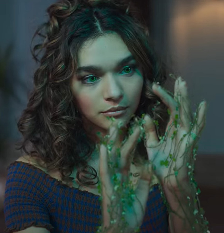 Flora uses her chlorokinesis, the ability to manipulate plant life, to grow vines on her hands. Photo courtesy of Netflix