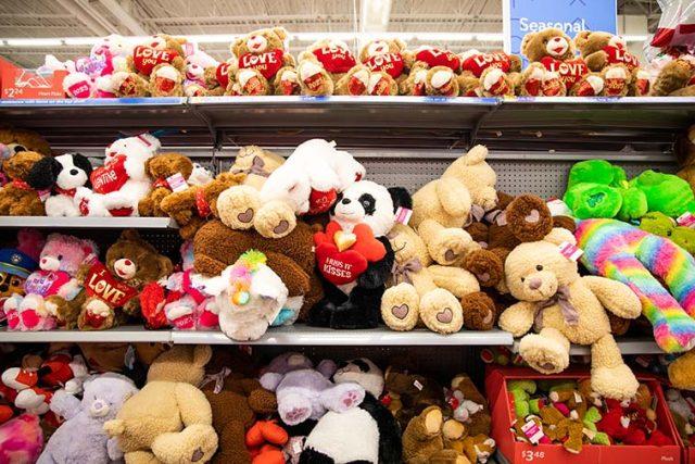 Stuffed valentines day bears stacked on a shelf at Walmarts seasonal section for shoppers to buy for their significant othe Joel Solis/The Collegian