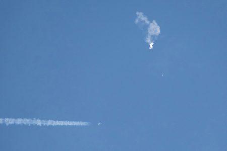 Debris falling from the sky after an alleged Chinese spy balloon was shot down by an F-22 military fighter jet over Surfside Beach, South Carolina, Saturday, Feb. 4, 2023. (Joe Granita/Zuma Press/TNS)